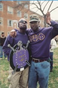 Geddis (left) poses with his dean, Lenny Lloyd (right), during his Spring 1996 probate initiating him as a member of Omega Psi Phi Fraternity, Inc., Alpha Chapter at Howard University. (Photo courtesy of La'Mont Geddis)
