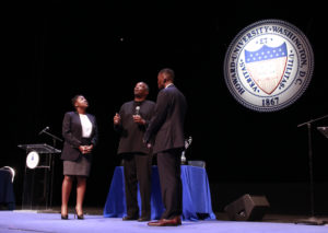 Dr. Greg Carr, chair of Howard University's Afro-American Studies Department, flips a coin to determine who goes first during the 2016 AT&T Nation's Classic "Game Before The Game" #TheRealHUDebate at Cramton Auditorium, Friday, Sept. 16. (Photo Credit: Paul Holston, Editor-in-Chief/The Hilltop)